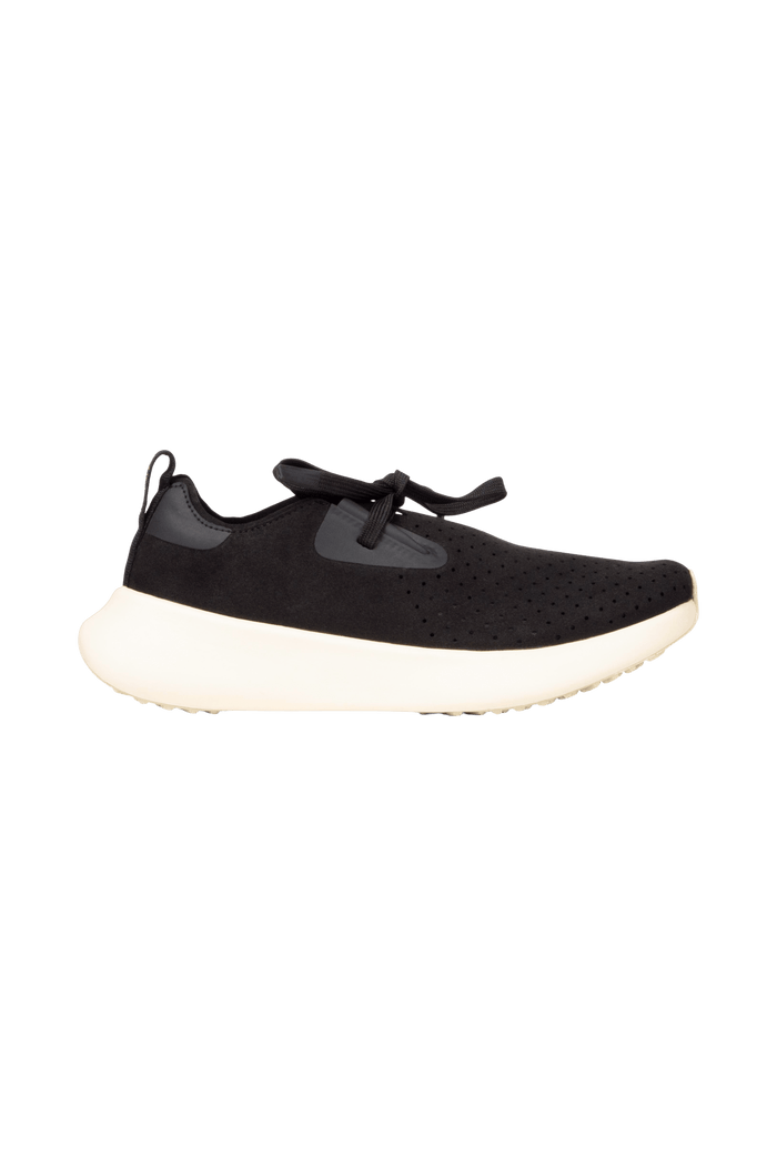 Side view of a Native Shoes Adults Apollo 10 Footwear in Jiffy Black / Tapioca Off White
