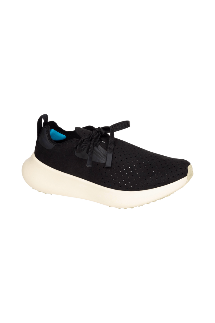 Angled view of a Native Shoes Apollo 10 | Jiffy Black / Tapioca Off White Footwear in Jiffy Black / Tapioca Off White