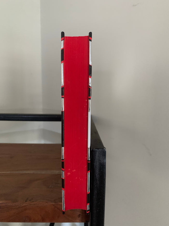 By Royal Command with sprayed red page edges (signed)