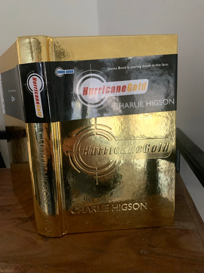 Hurricane Gold with gold sprayed page edges and promotional flyer (signed)