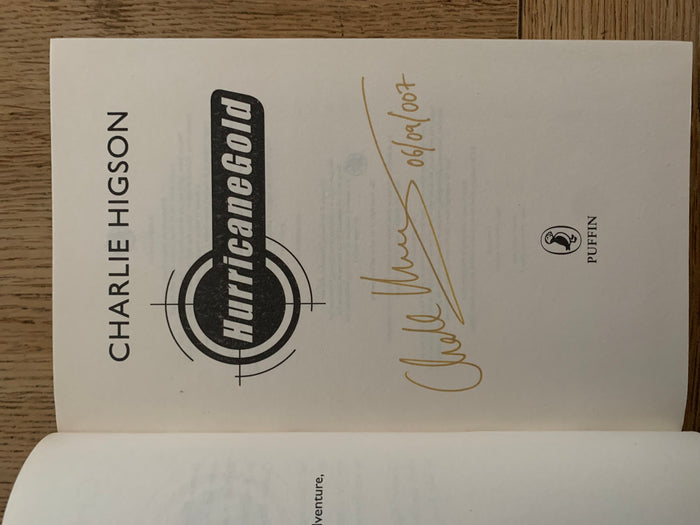 Hurricane Gold with gold sprayed page edges and promotional flyer (signed)