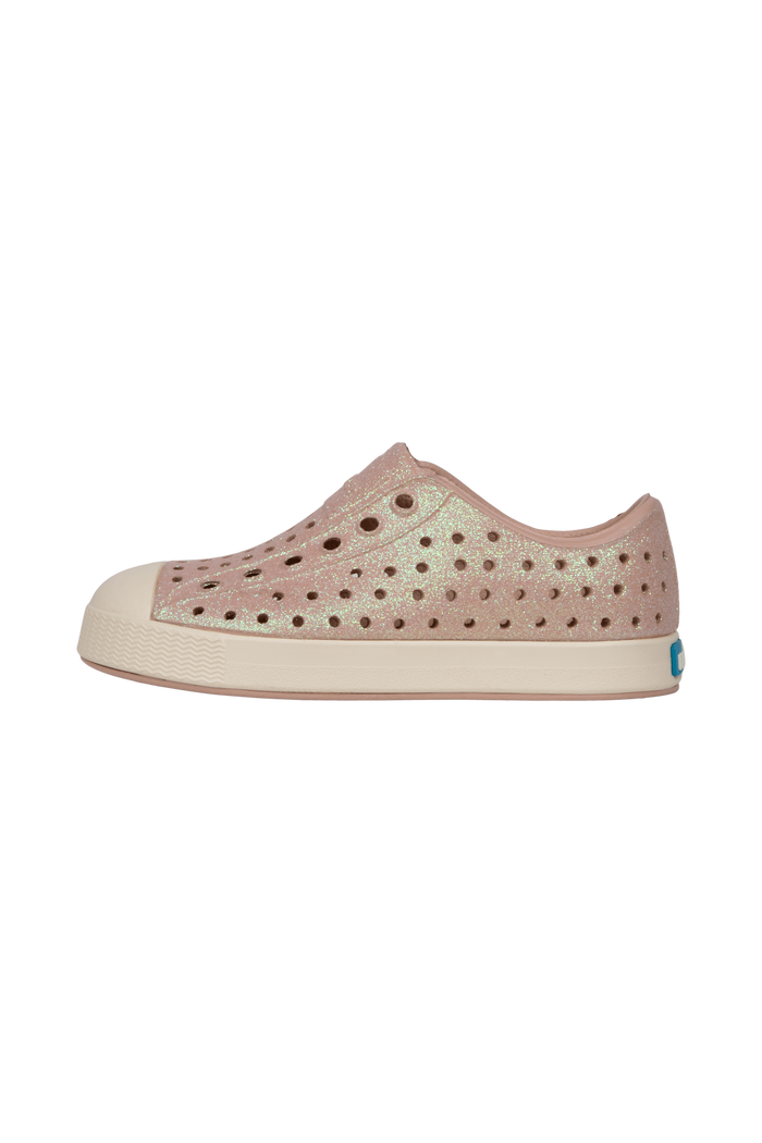 Angled view of a Native Shoes Kids Jefferson Bio-Bling Kids | Chameleon Pink Bling / Bone White Footwear in Chameleon Pink Bling / Bone White