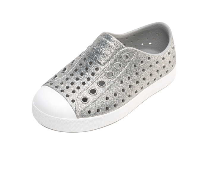 Angled view of a Native Shoes Kids Jefferson Bio-Bling Kids | Platinum Bling / Shell White Footwear in Platinum Bling / Shell White