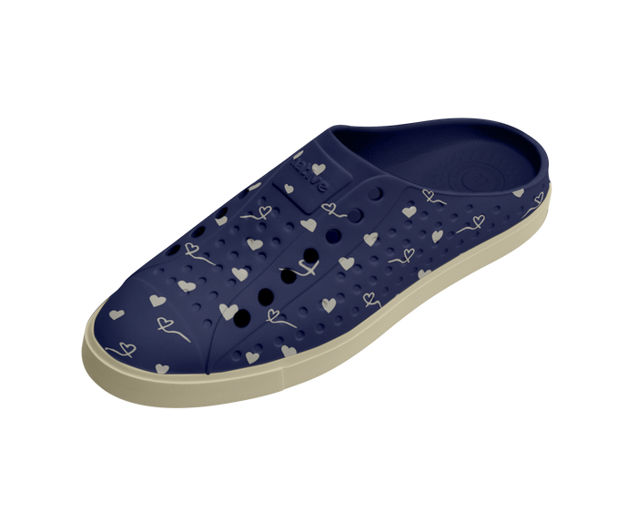 Angled view of a Native Shoes Jefferson Clog Wanderfoam Prnt | Bone White / Bone White / Regatta Hearts Footwear in Bone White / Bone White / Regatta Hearts
