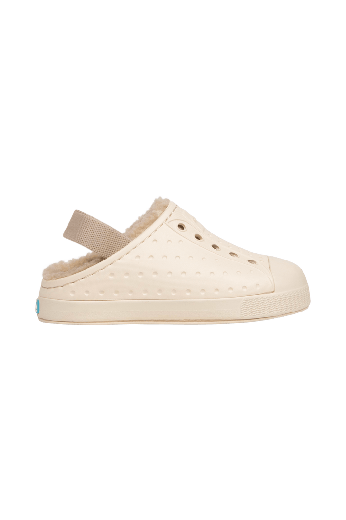 Side view of a Native Shoes Kids Jefferson Cozy Kids Footwear in Bone White / Bone White / Flax Tan