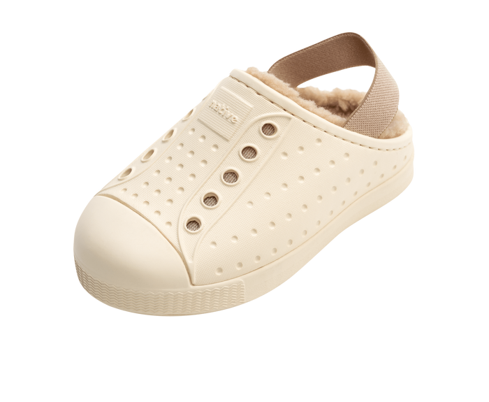 Angled view of a Native Shoes Kids Jefferson Cozy Kids | Bone White / Bone White / Flax Tan Footwear in Bone White / Bone White / Flax Tan
