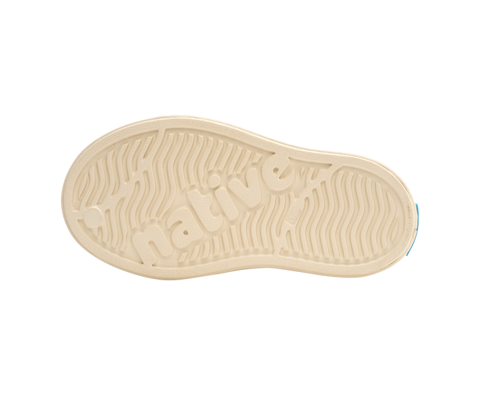 Bottom view of a Native Shoes Kids Jefferson Cozy Kids | Bone White / Bone White / Flax Tan Footwear in Bone White / Bone White / Flax Tan