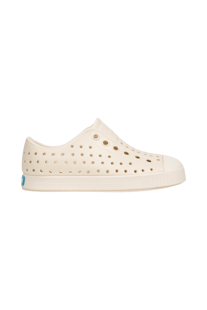 Side view of a Native Shoes Kids Jefferson Kids Footwear in Bone White / Bone White