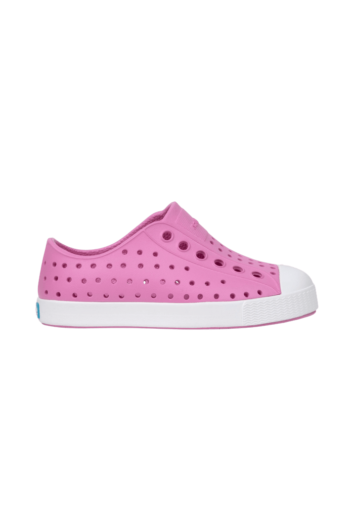 Side view of a Native Shoes Kids Jefferson Kids Footwear in Malibu Pink / Shell White