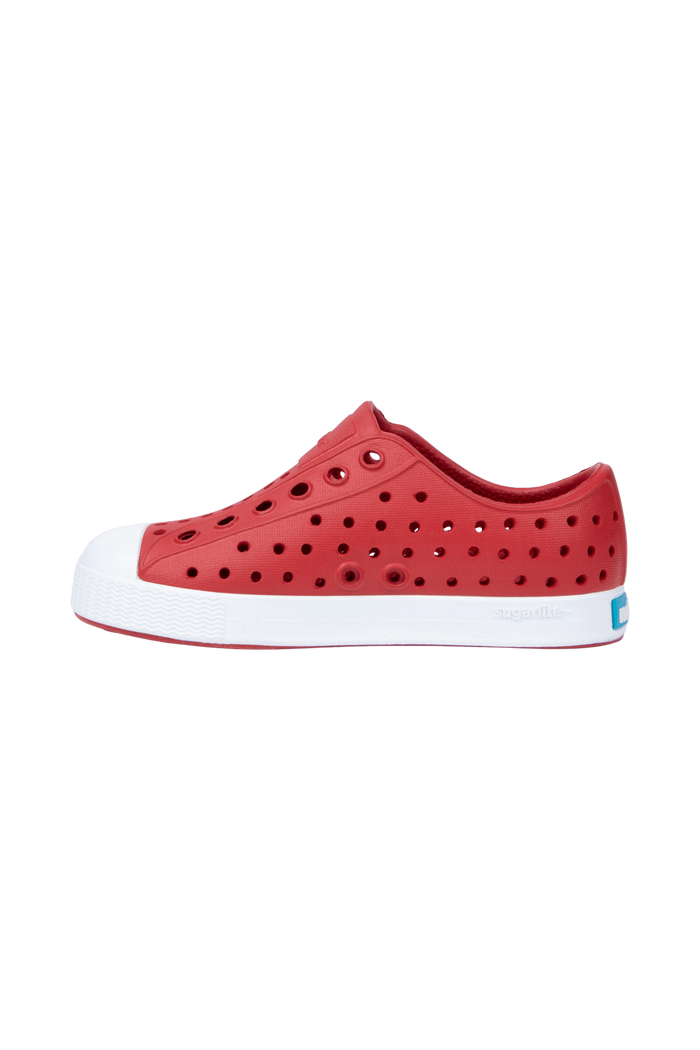 Angled view of a Native Shoes Kids Jefferson Kids | Ruby Red / Shell White Footwear in Ruby Red / Shell White