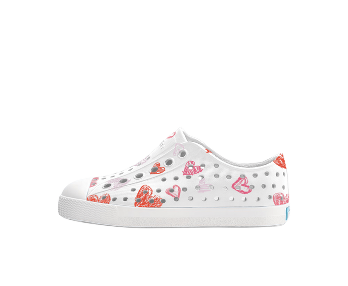 Side view of a Native Shoes Kids Jefferson Print Kids Footwear in Shell White / Shell White / Heart Graffiti