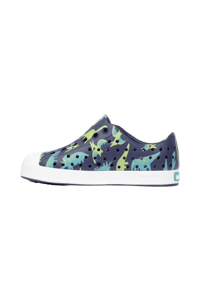 Angled view of a Native Shoes Kids Jefferson Print Kids | Rgtabl/Shlwht/Tnkdino Footwear in Rgtabl/Shlwht/Tnkdino