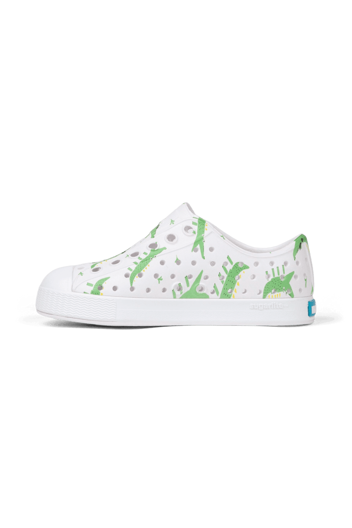 Bottom view of a Native Shoes Kids Jefferson Print Kids | Shell White / Shell White / Alligators Footwear in Shell White / Shell White / Alligators