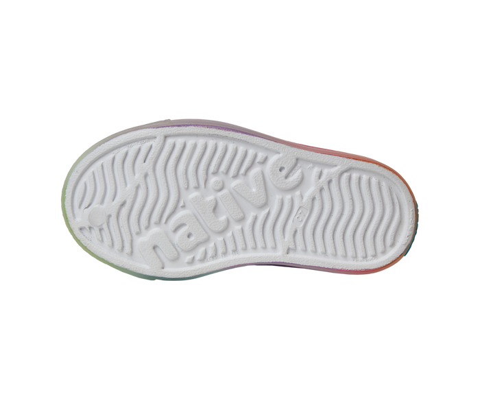 Bottom view of a Native Shoes Kids Jefferson Print Kids | Shell White / Transparent / Rainbow Spray Footwear in Shell White / Transparent / Rainbow Spray