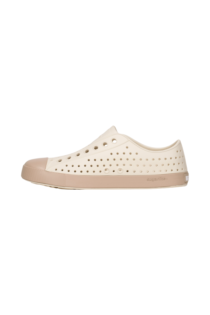 Angled view of a Native Shoes Jefferson Wanderfoam Block | Bnwht/Flxtn/Campvanbloc Footwear in Bnwht/Flxtn/Campvanbloc