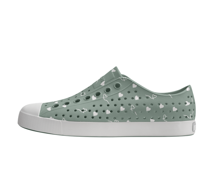 Side view of a Native Shoes Adults Jefferson Wanderfoam Print Footwear in Relax Green / Shell White / Freesia Star Badge