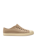Side view of a Native Shoes Adults Jefferson Footwear in Flax Tan / Bone White