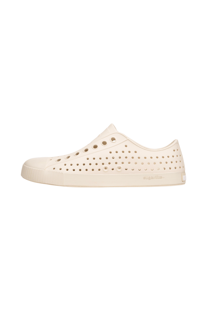 Angled view of a Native Shoes Jefferson | Bone White / Bone White Footwear in Bone White / Bone White