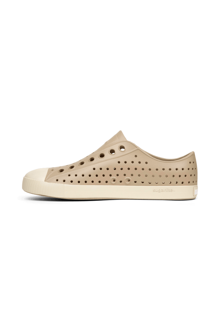 Angled view of a Native Shoes Jefferson | Flax Tan / Bone White Footwear in Flax Tan / Bone White