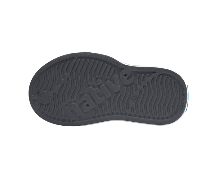 Bottom view of a Native Shoes Kids Miles Block Kids | Gravity Grey / Shell White / Dinosaur Block Footwear in Gravity Grey / Shell White / Dinosaur Block