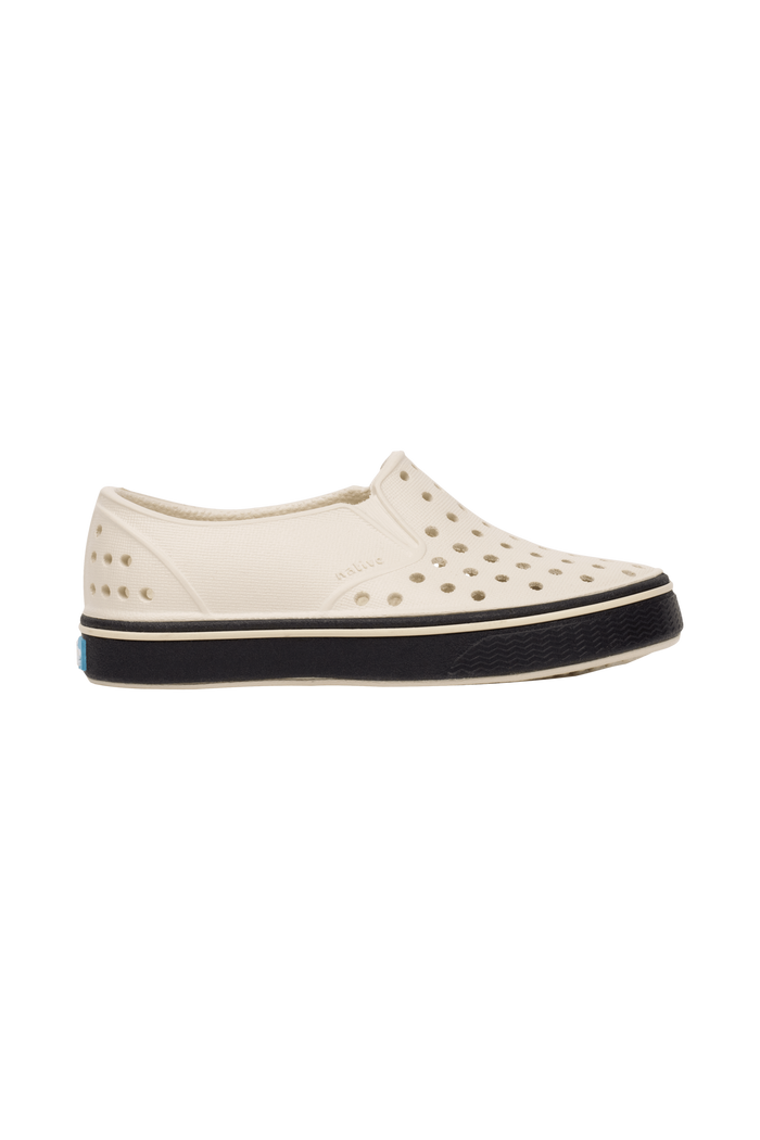 Side view of a Native Shoes Kids Miles Kids Footwear in Bnwht/Jfyblk
