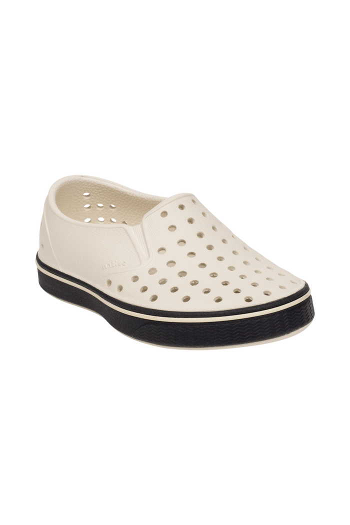 Bottom view of a Native Shoes Kids Miles Kids | Bnwht/Jfyblk Footwear in Bnwht/Jfyblk