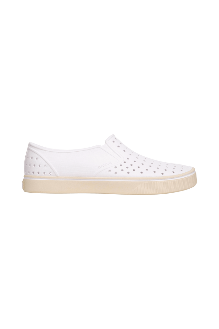 Side view of a Native Shoes Adults Miles Wanderfoam Footwear in Shell White / Bone White