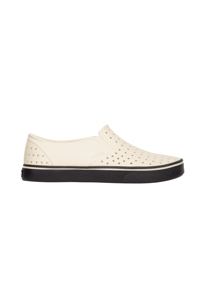 Side view of a Native Shoes Adults Miles Wanderfoam Footwear in Bnwht/Jfyblk