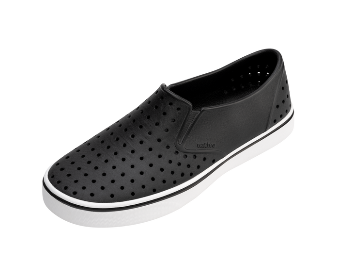 Angled view of a Native Shoes Miles | Jiffy Black / Shell White Footwear in Jiffy Black / Shell White