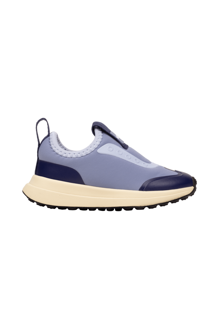 Side view of a Native Shoes Kids Robbie Dash Kids Footwear in Oasisbl/Tapoffwht/Jfyblk