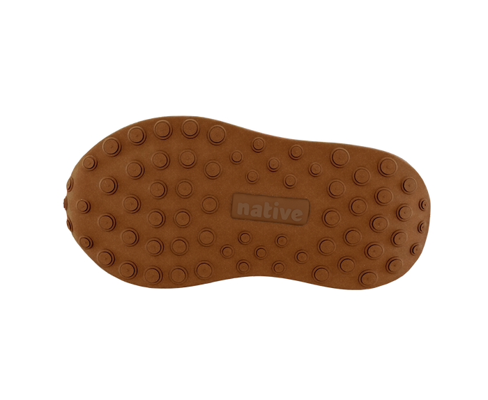 Bottom view of a Native Shoes Kids Robbie Dash Kids | Bone White / Tapioca Off White / Hazel Brown Footwear in Bone White / Tapioca Off White / Hazel Brown