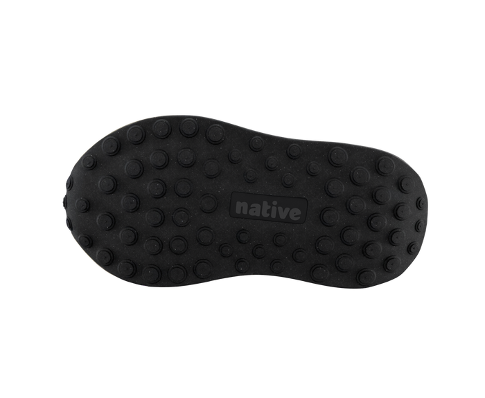 Bottom view of a Native Shoes Kids Robbie Dash Kids | Hyams Grey / Tapioca Uv / Jiffy Black Footwear in Hyams Grey / Tapioca Uv / Jiffy Black