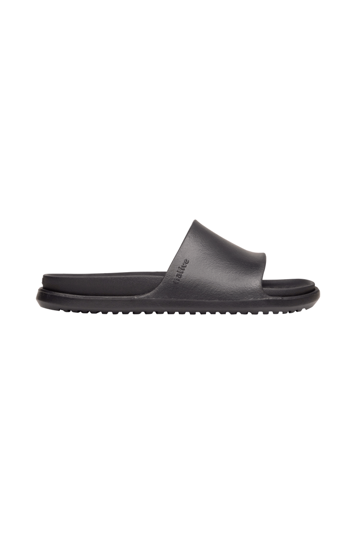 Side view of a Native Shoes Adults Spencer Lx Wanderfoam Footwear in Jiffy Black / Jiffy Black
