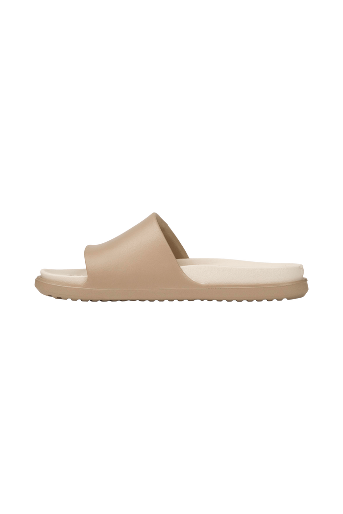 Angled view of a Native Shoes Spencer Lx Wanderfoam | Flax Tan / Bone White Footwear in Flax Tan / Bone White