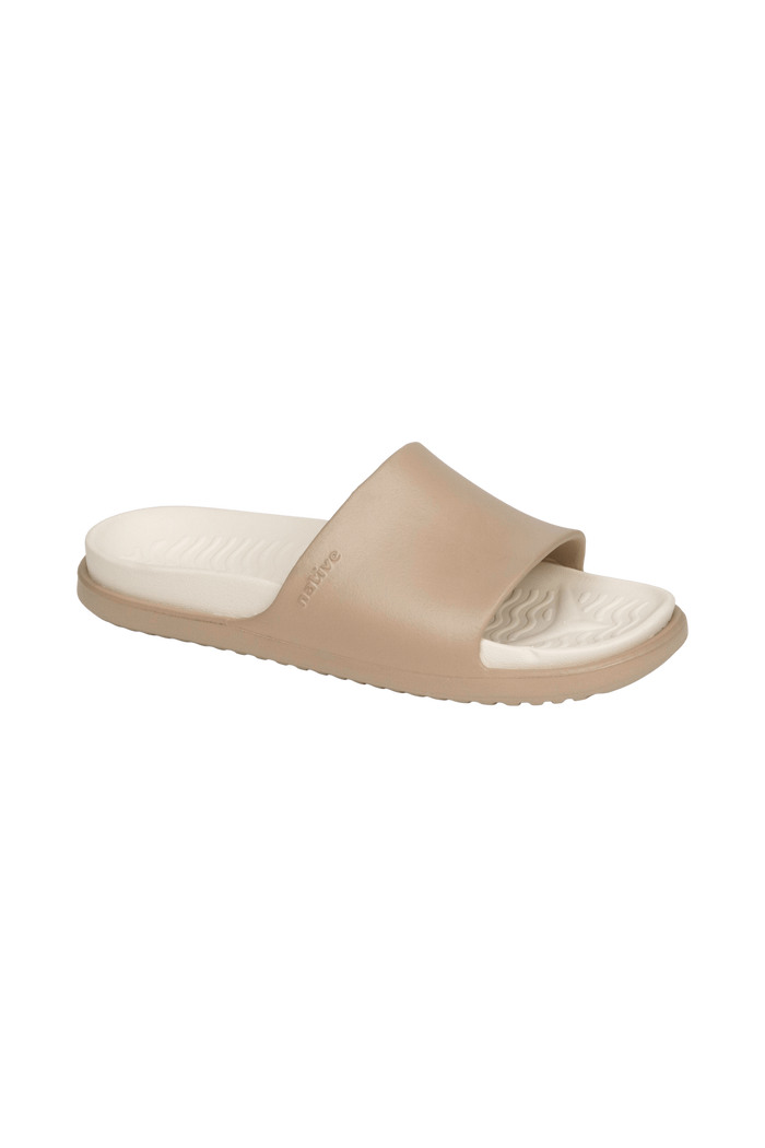 Bottom view of a Native Shoes Spencer Lx Wanderfoam | Flax Tan / Bone White Footwear in Flax Tan / Bone White