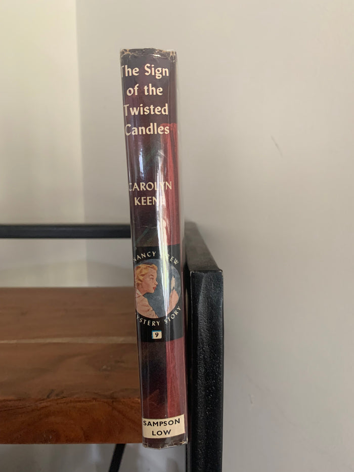 The Sign of the Twisted Candles